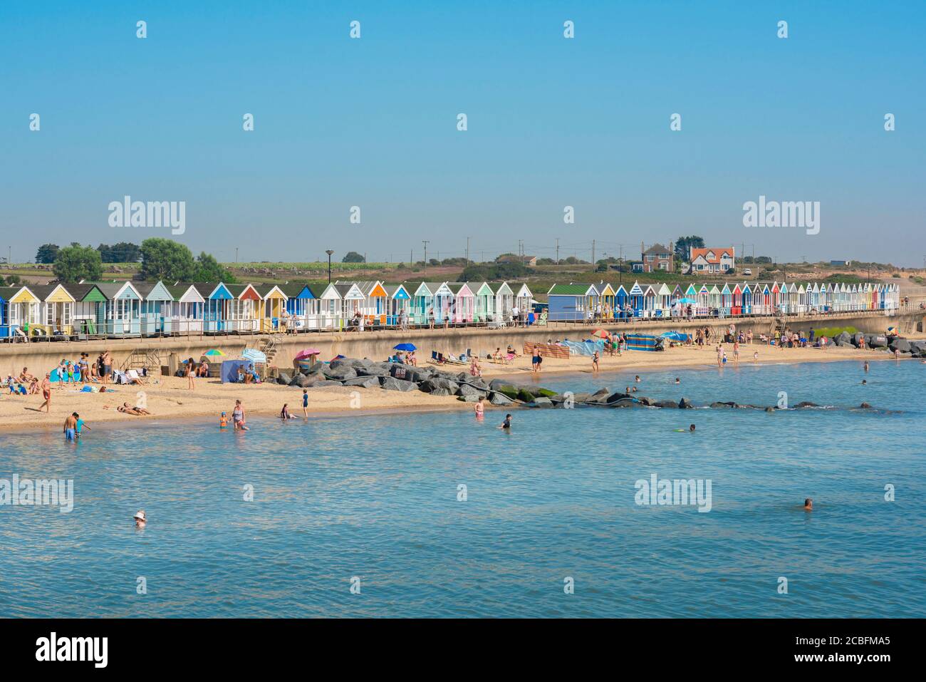 Suffolk summer seaside, view in summer of people enjoying a day on North Parade beach in Southwold, Suffolk, East Anglia, England, UK. Stock Photo