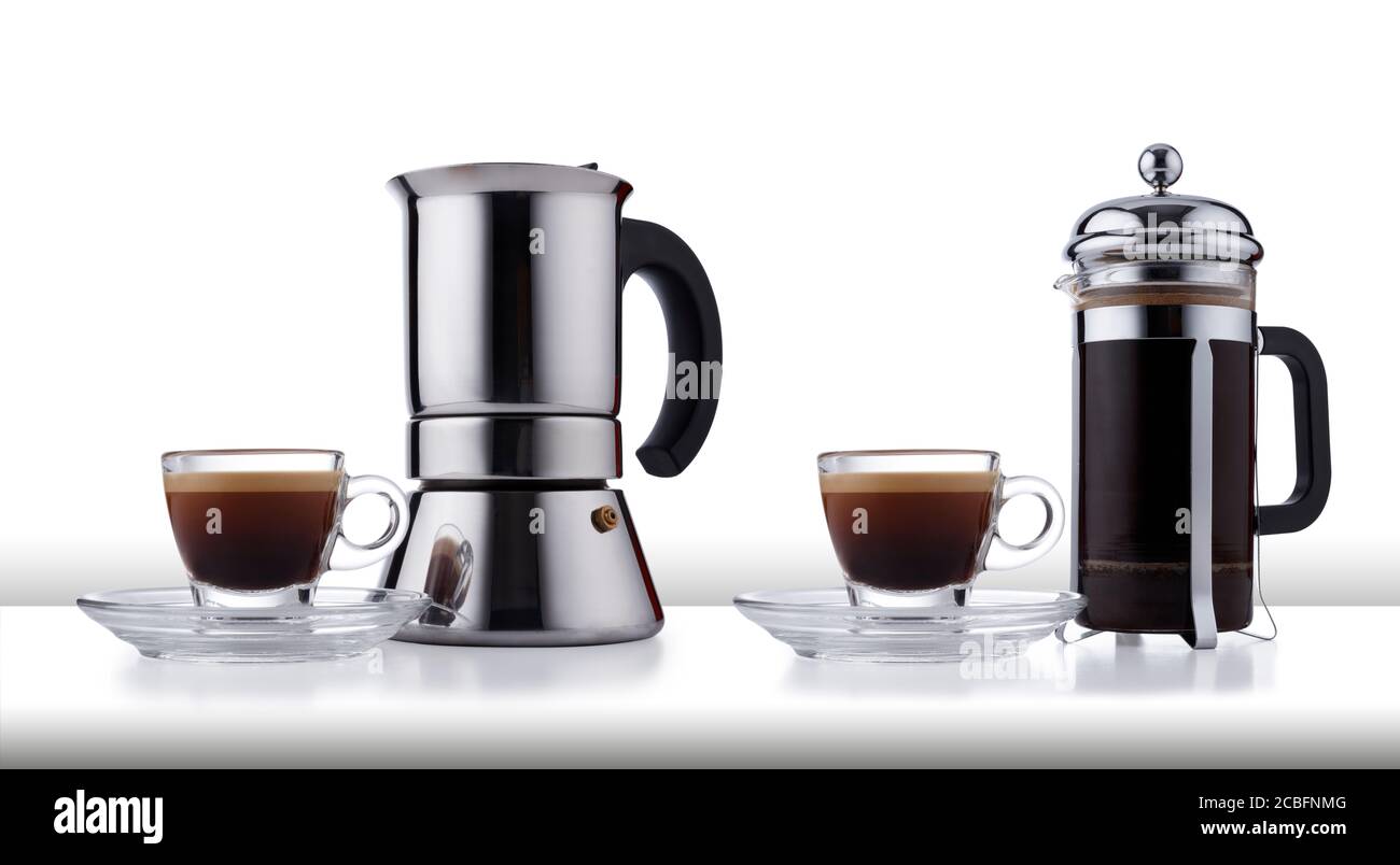Two different styles of coffee making pot, and expresso cup and saucer