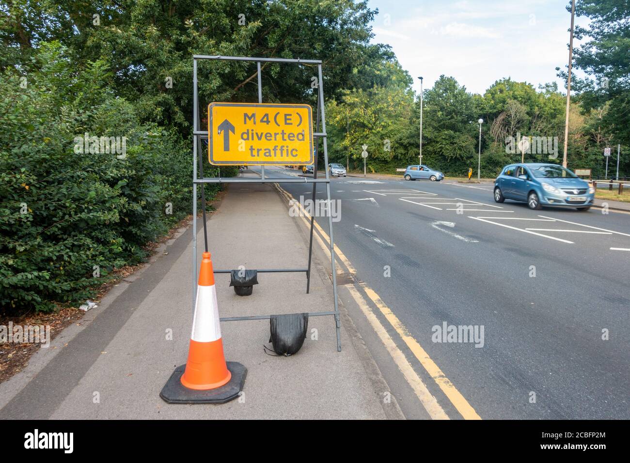 A sign on the pavement alongside the A4 in Reading tells drivers who have been diverted off the M4 where to go. Stock Photo