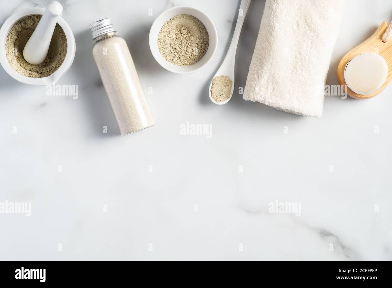 Ubtan powder, homemade face mask ingredients, cleaning brush, tower, on