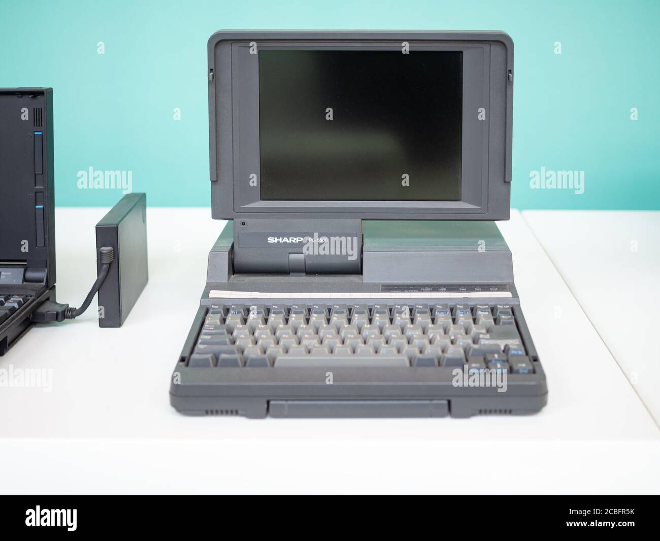 TERRASSA, SPAIN-AUGUST 9, 2020: 1984 Sharp PC-5500 Vintage Laptop in the National Museum of Science and Technology of Catalonia Stock Photo