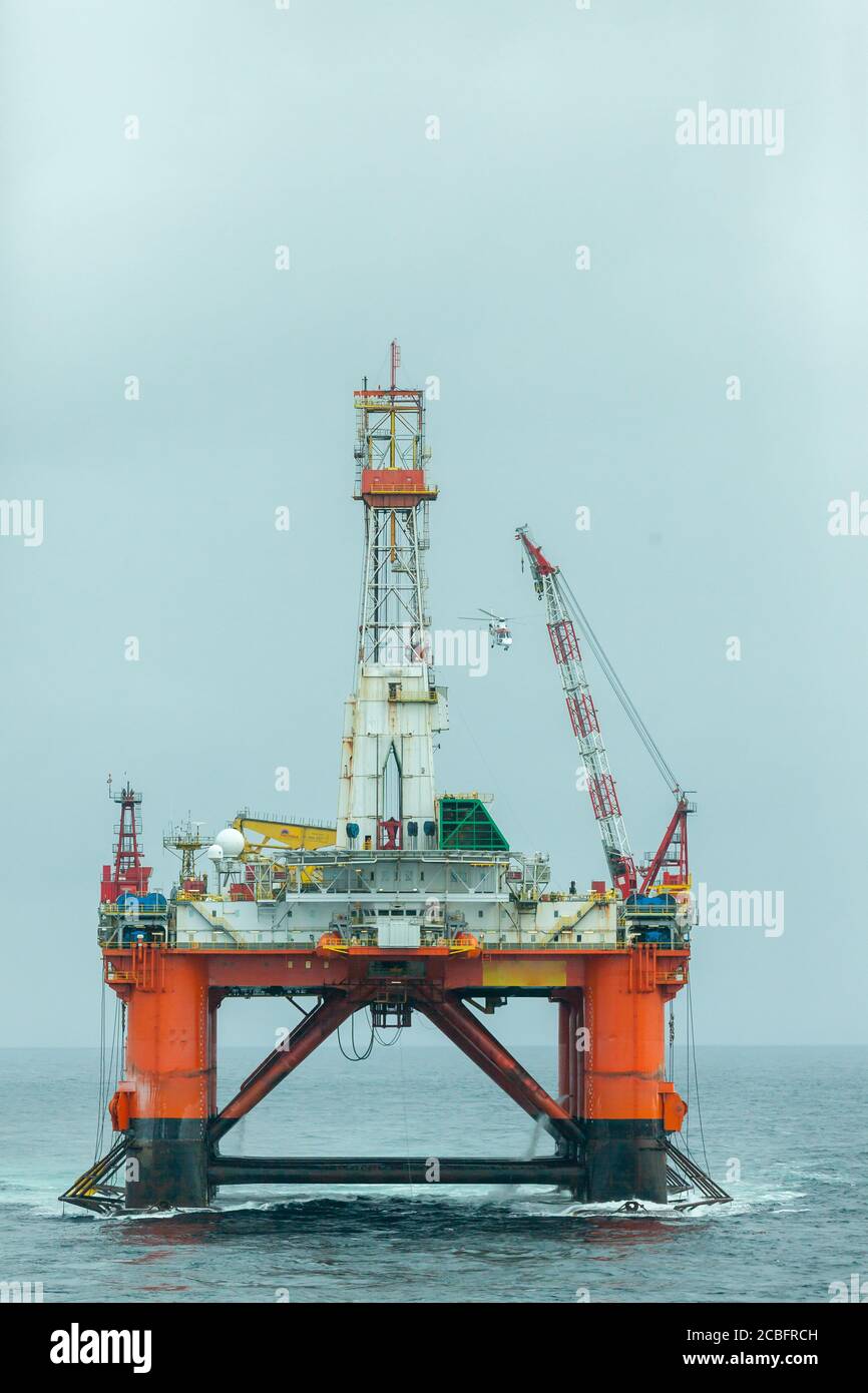 NORTH SEA NORWAY - 2015 MAY 24. The semi-submersible drilling rig Transocean Leader recieve the Pilot helicopter on deck Stock Photo