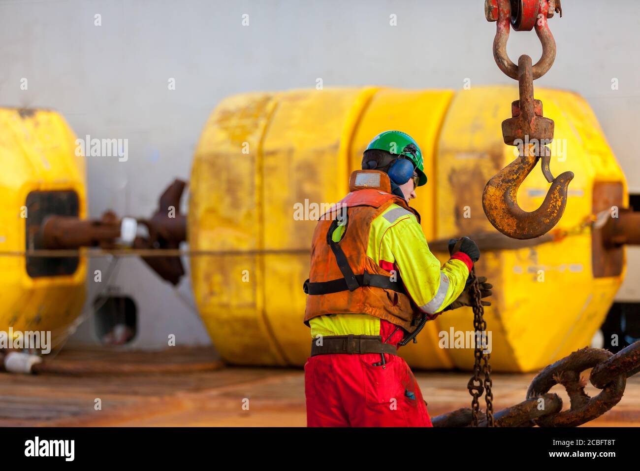 NORTH SEA, NORWAY - 2015 JANUARY 19. Able body seaman working on deck under anchor handling operation Stock Photo