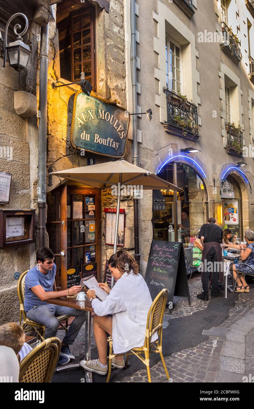 Evening diners on terrace of 'Aux Moules de Bouffay' restaurant, Rue Sainte-Croix, Nantes, Loire-Atlantique, France. Stock Photo