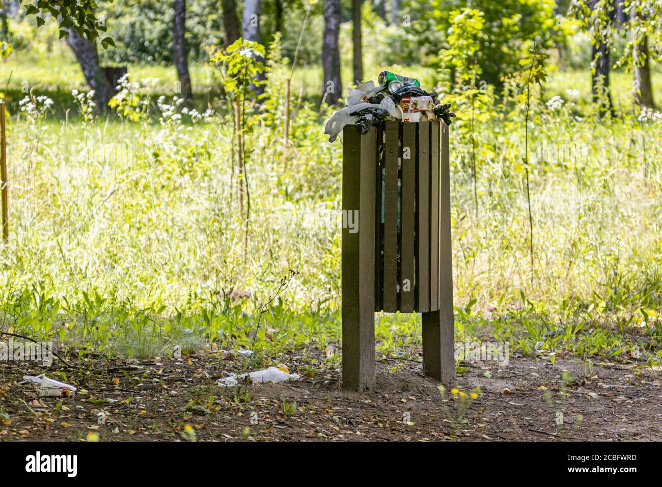 A full trash can in the local park Stock Photo Alamy