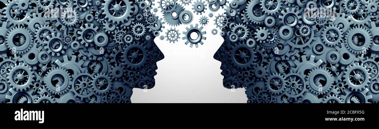 Knowledge transfer or teamwork and Leadership as an education symbol as two human heads shaped with gears and cogs working together as a team. Stock Photo