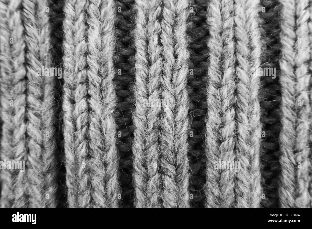 knitted wool background texture macro with selective focus grey ribbing Stock Photo