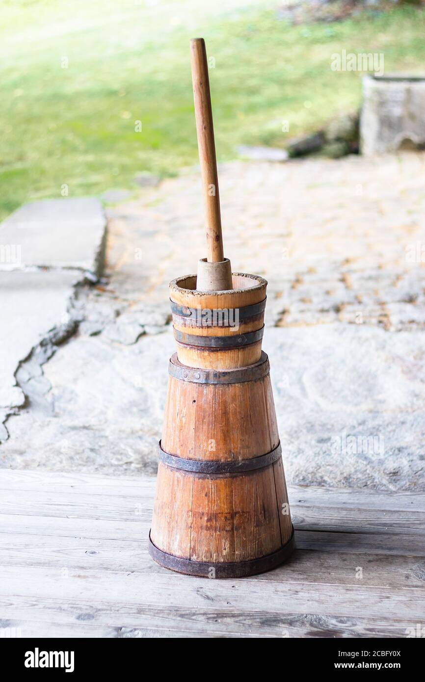 Butter churn - old traditional wooden plunger-type butter churn