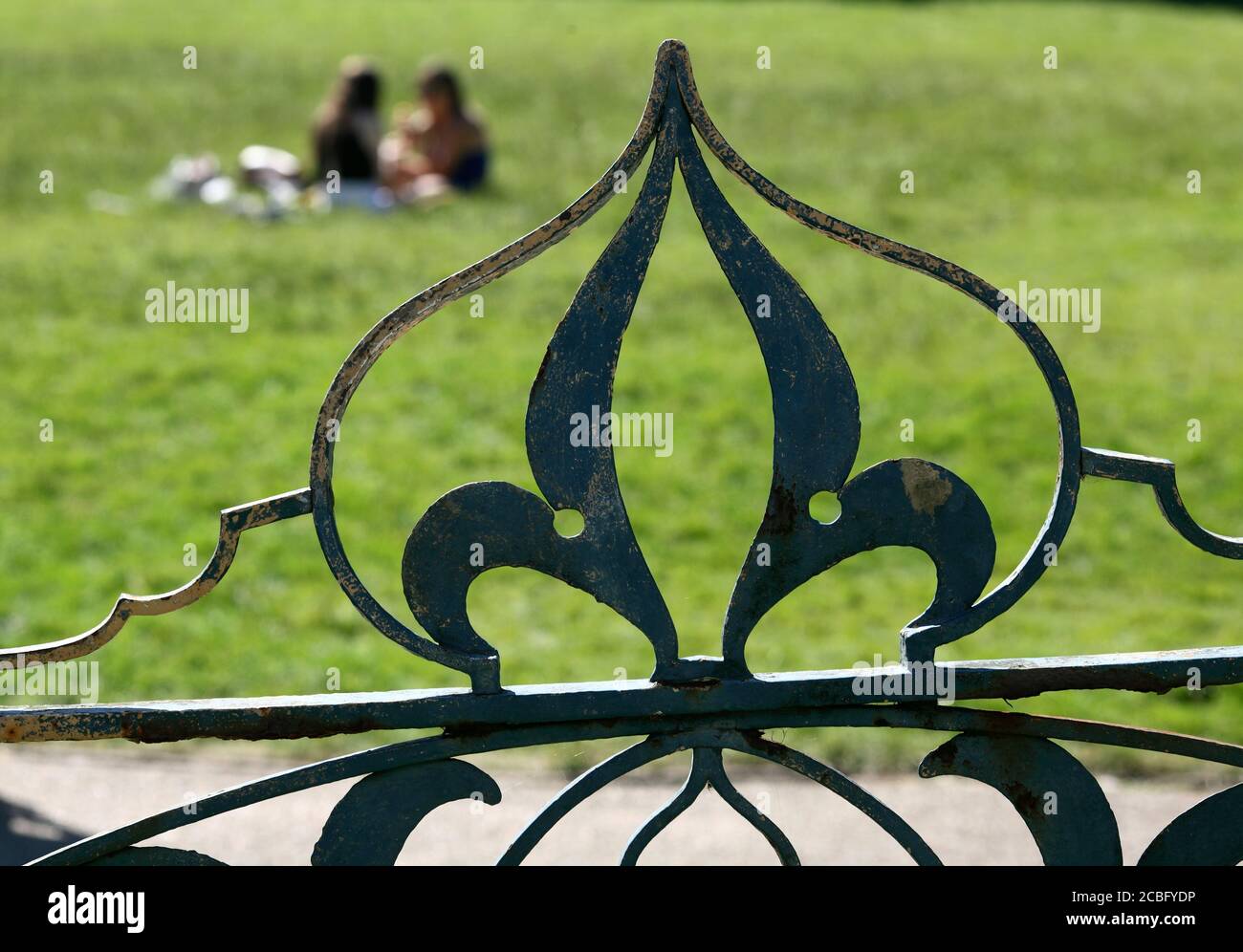 Decorative ironwork on top of a gate, overlooking lawns outside the  Brighton Pavilion. Shaped to resemble an onion dome (as on the Pavilion). Stock Photo
