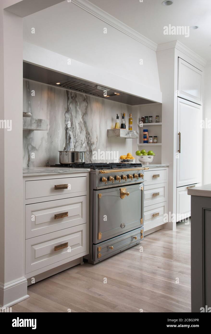Gray and White Kitchen with Marble Backsplash Stock Photo