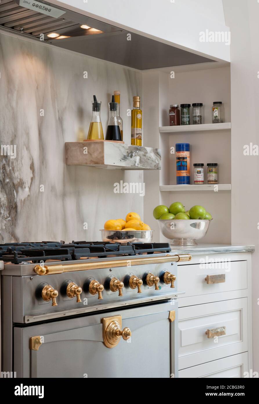 Gray and White Kitchen with Marble Backsplash Stock Photo