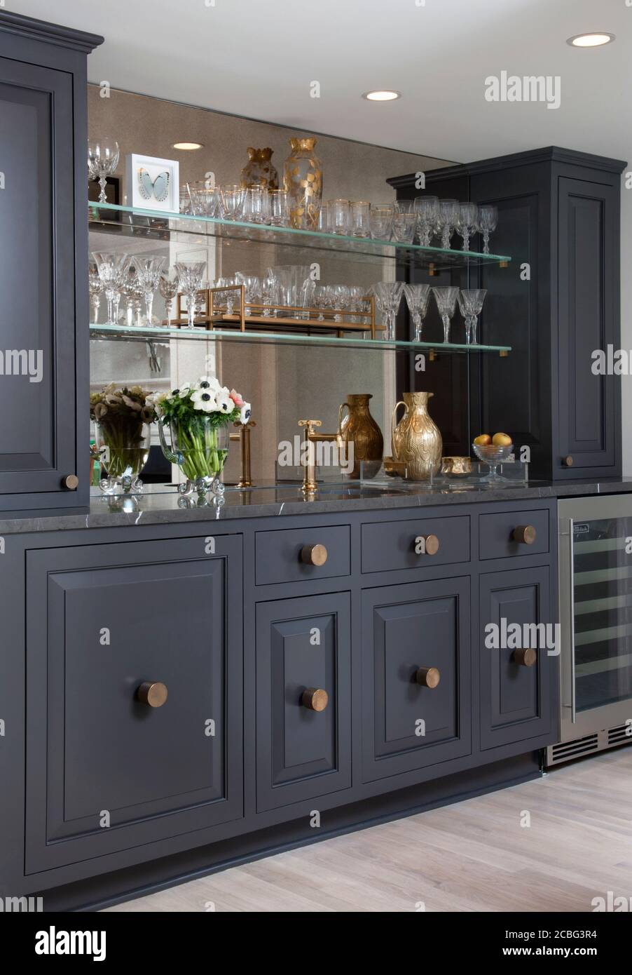 Gray custom bar storage and sink Stock Photo Alamy