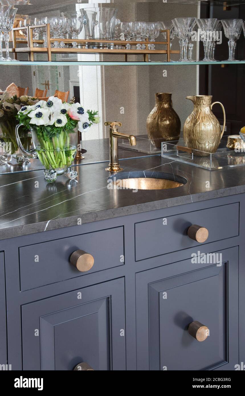 Gray custom bar storage and sink Stock Photo