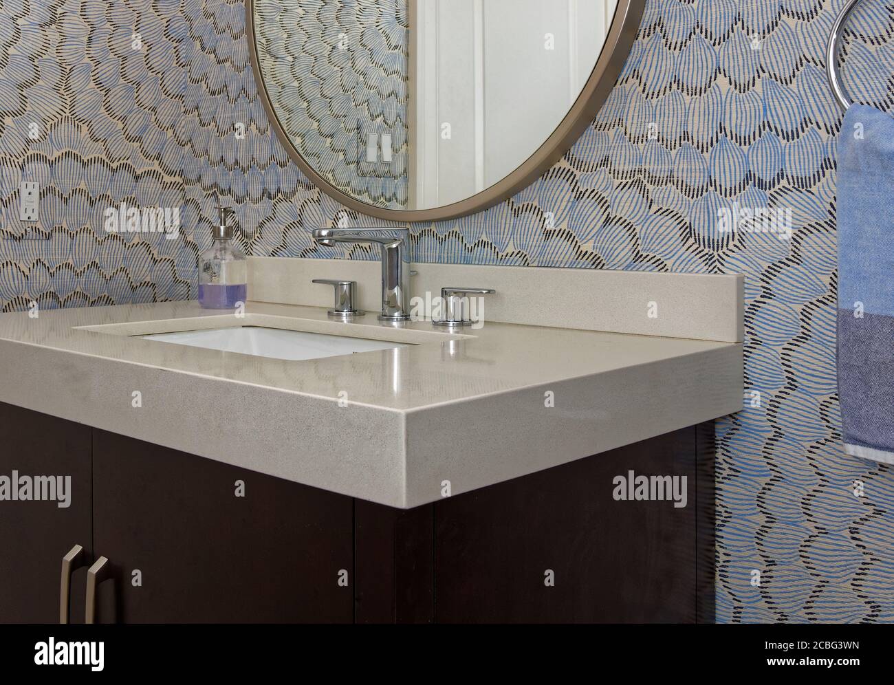 Powder room with Dark Vanity, Round Mirror Stock Photo - Alamy