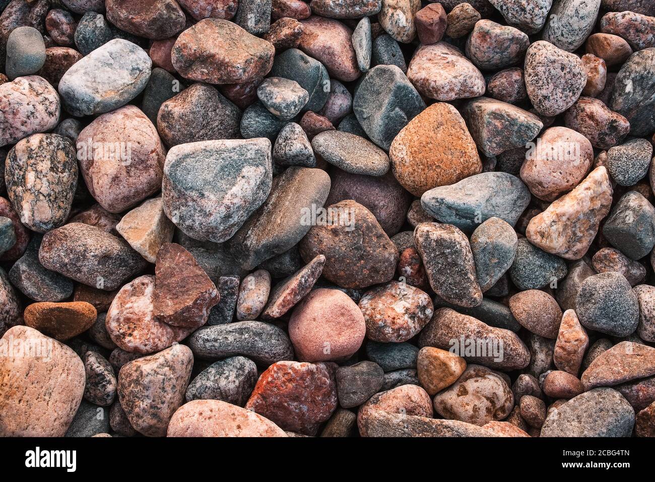 texture with multicolored stones on rocky beach Stock Photo