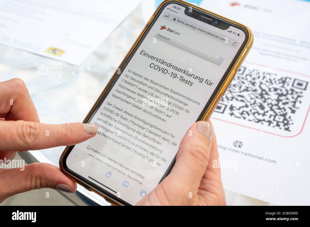 13 August 2020 Bavaria Munich A Woman Logs In With Her Smartphone To Take Part In The Corona Test At The Airport Photo Peter Kneffel Dpa Stock Photo Alamy