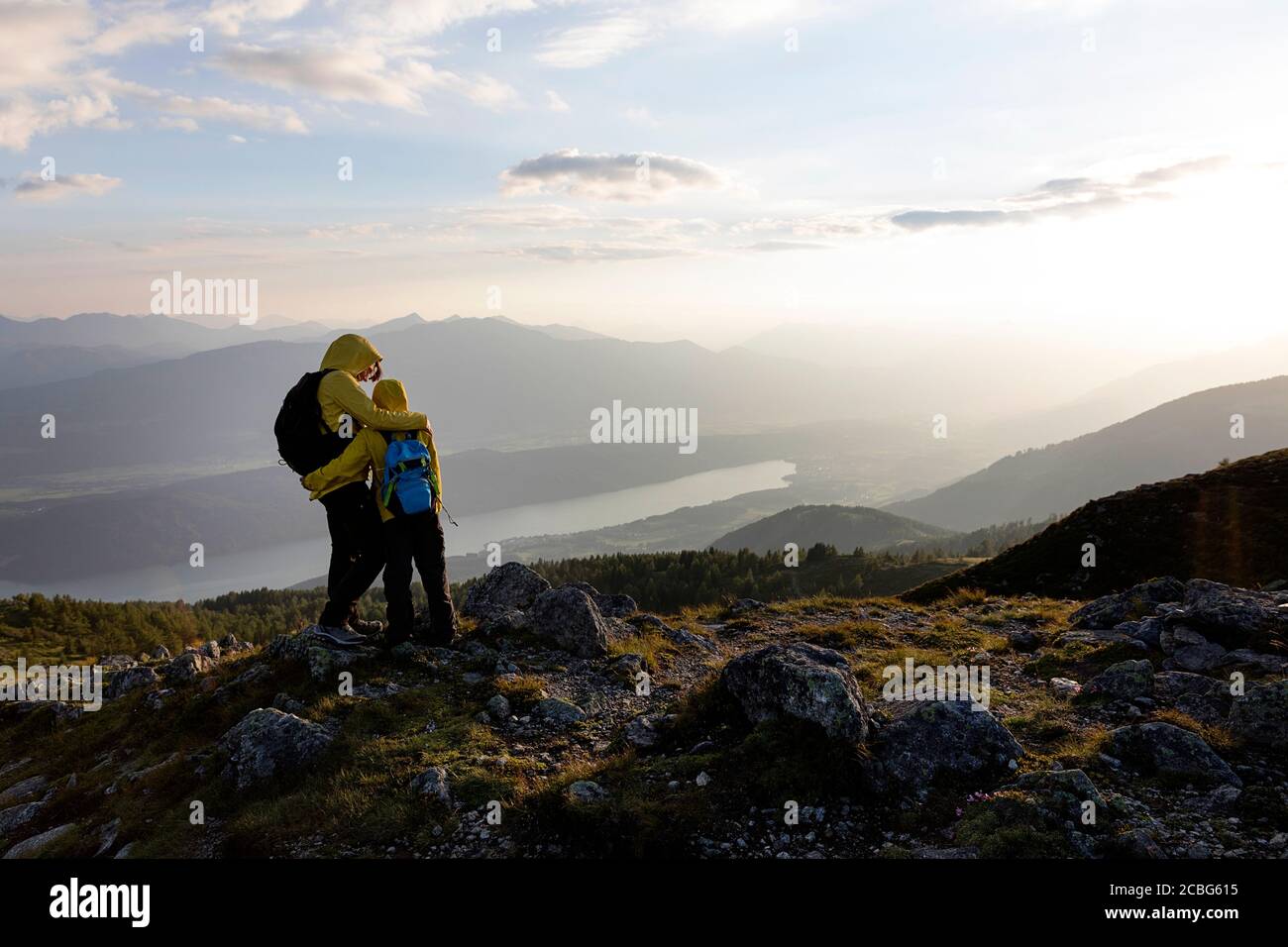 Mother and son Mother and son having a good time outdoors on mountain with a view over the lake, Granattor, Lammersdorf Mountain, Austria Stock Photo