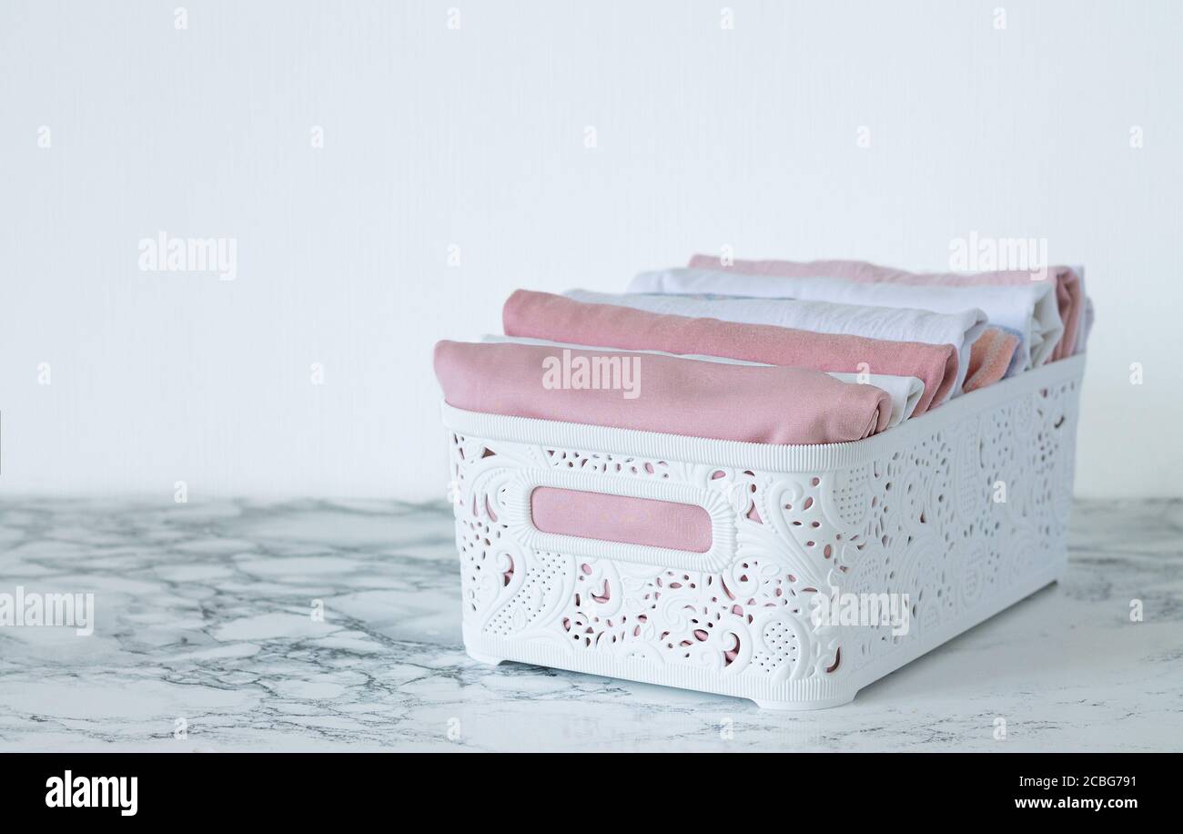 Vertical clothes storage and house cleaning concept. Clean apparel in