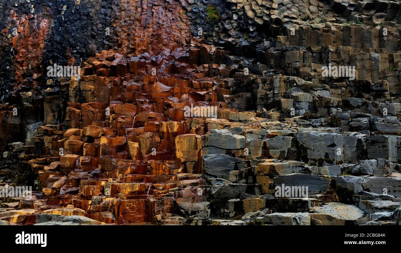 Gold and Grey Basalt Columns at Studlagil Basalt Canyon in East Iceland Stock Photo