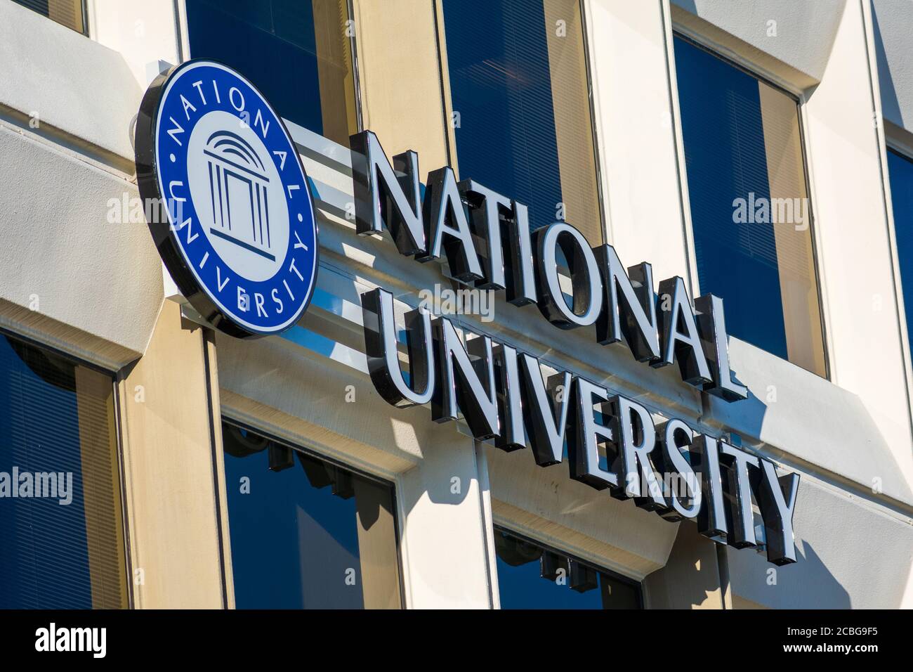 National University sign on a Silicon Valley campus of a private university with programs designed for adult learners - San Jose, California, USA - 20 Stock Photo