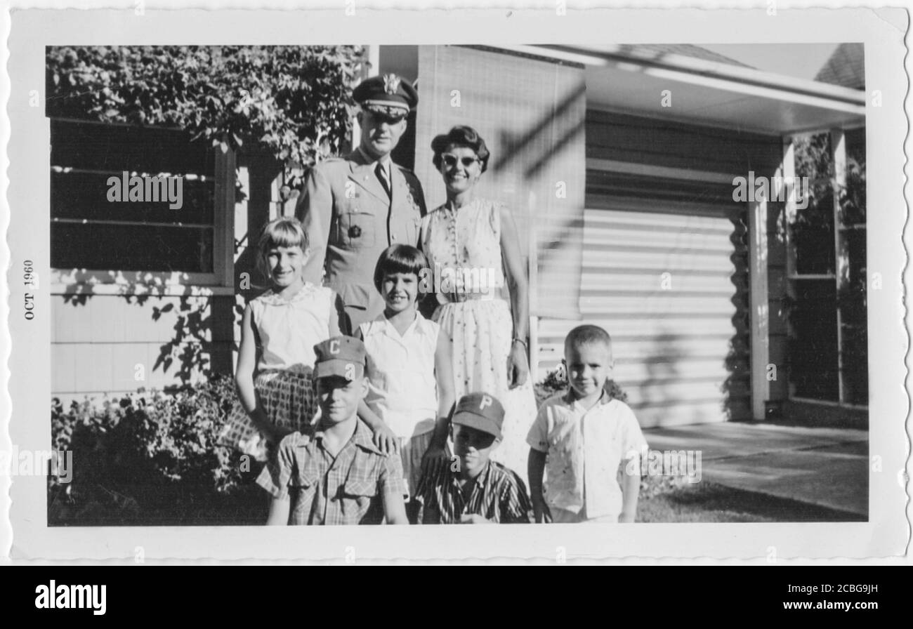 Large military family posing in front of their home, 1960, Atlanta, Georgia, USA Stock Photo