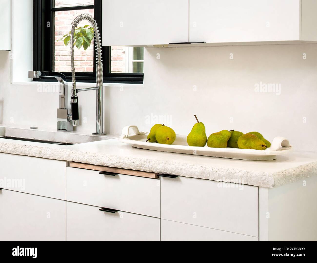Contemporary White Kitchen with Concrete Countertop Stock Photo