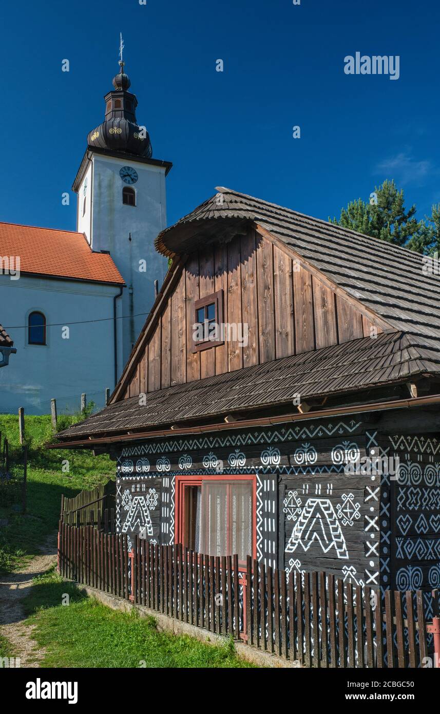 Decorated wooden house, church, in village of Cicmany, Strážov Mountains, Zilina Region, Slovakia Stock Photo