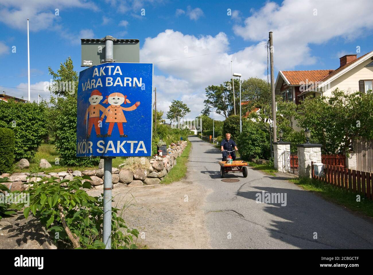 Man driving a traditional flakmopeder in Styrso Island, Gothenburg archipelago, Sweden Stock Photo