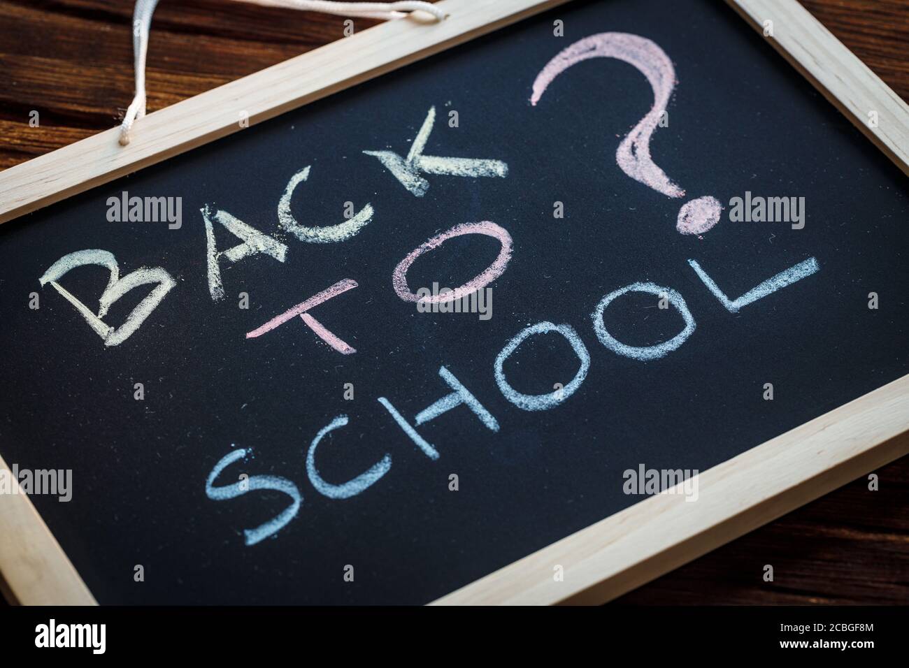 Back to School, The chalkboard lettering and a question mark. The concept  of risk related to school attendance by children and young people in the  tim Stock Photo - Alamy