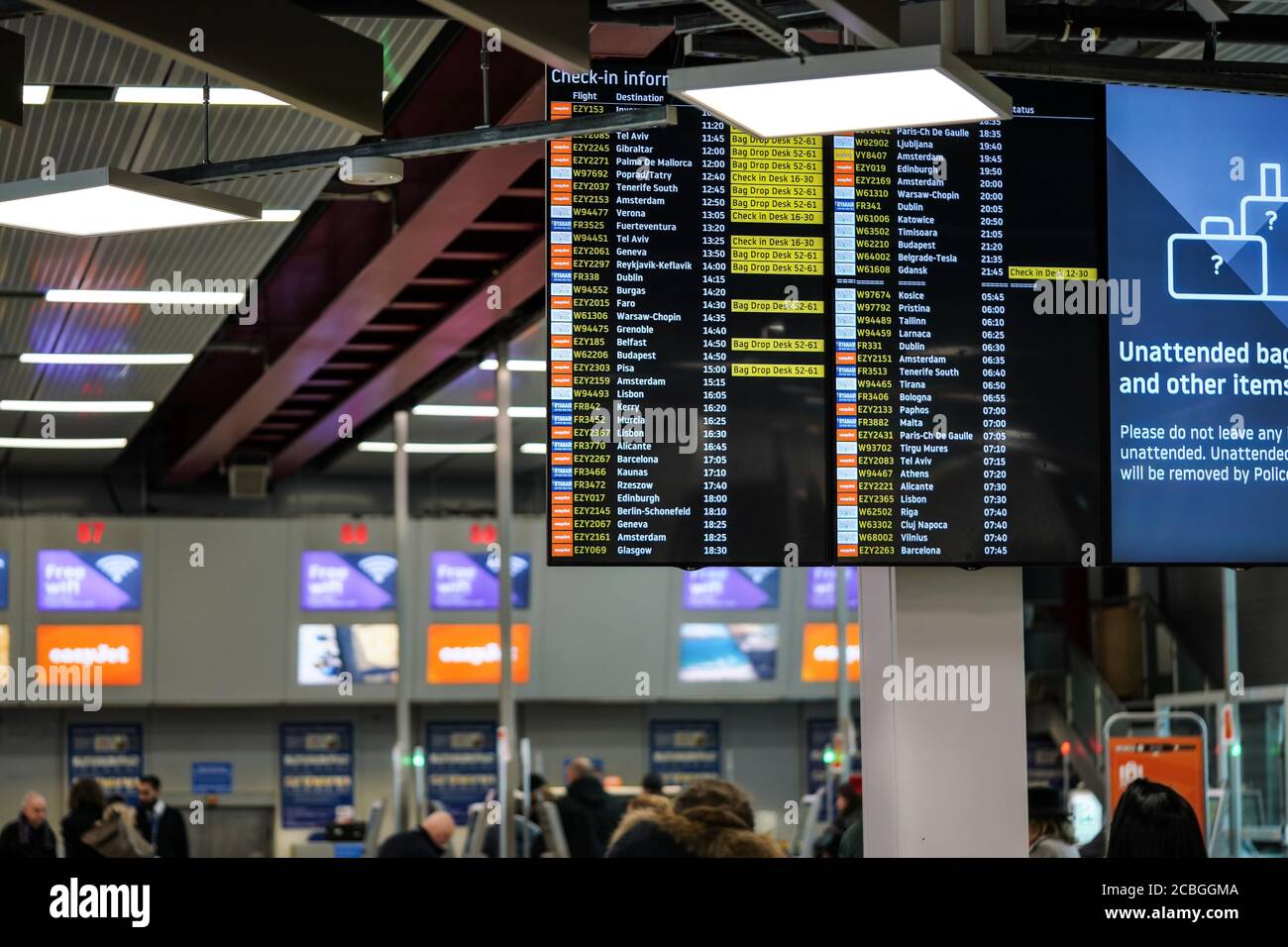 London, United Kingdom - February 05, 2019: Departures and check-in information board at Luton airport. LLA is fifth busiest airport in the UK serving Stock Photo