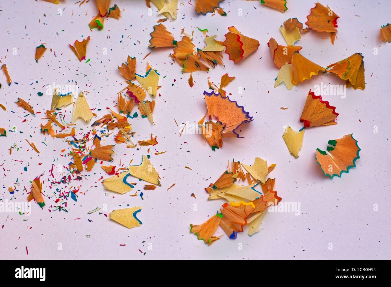 Color pencils shavings on white background Stock Photo