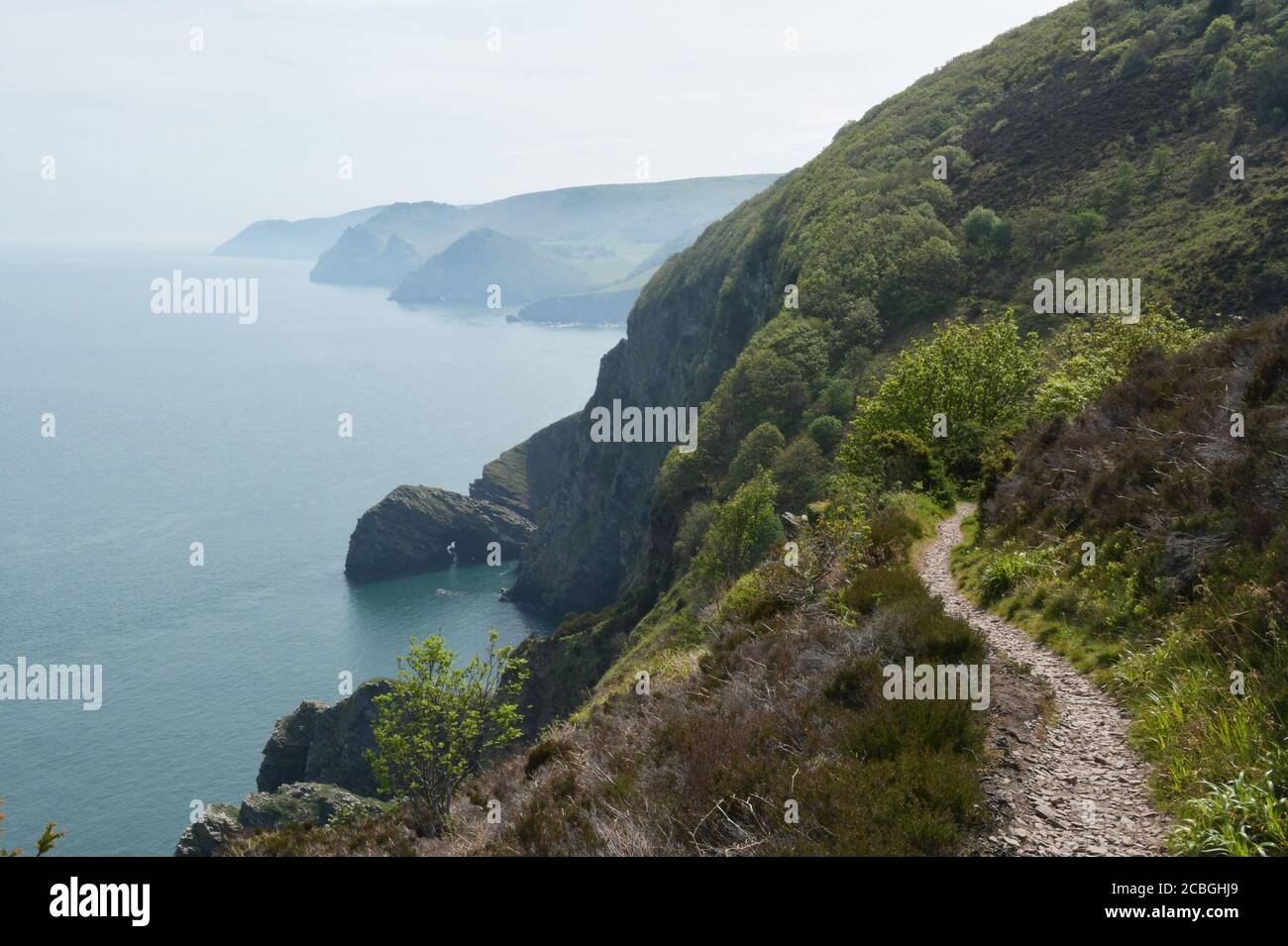 Misty view on a spring morning along the North Devon coast seen from the coast path between Heddon's Mouth and Woody bay.Devon.UK Stock Photo