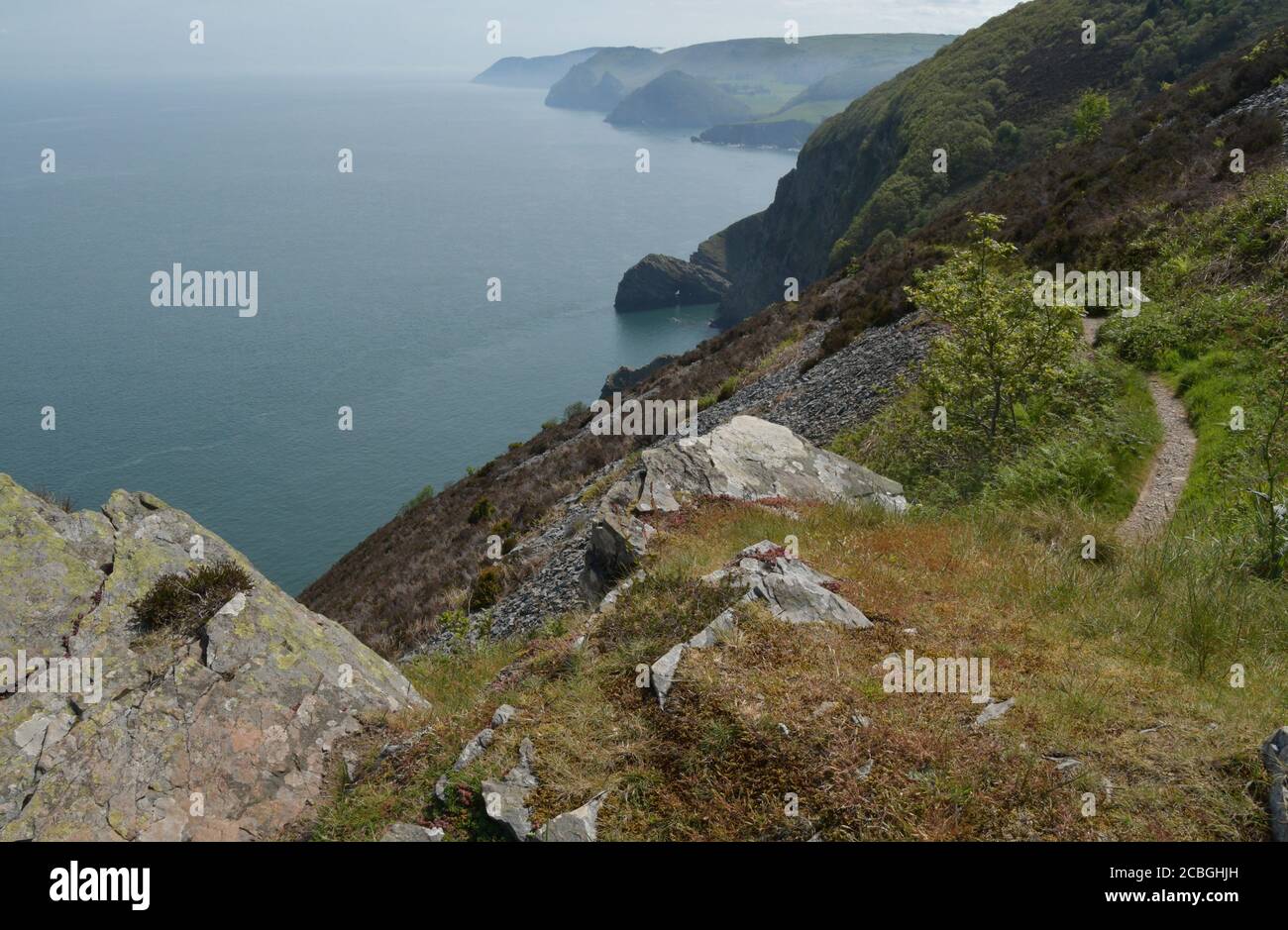 Misty view on a spring morning along the North Devon coast seen from the coast path between Heddon's Mouth and Woody bay.Devon.UK Stock Photo