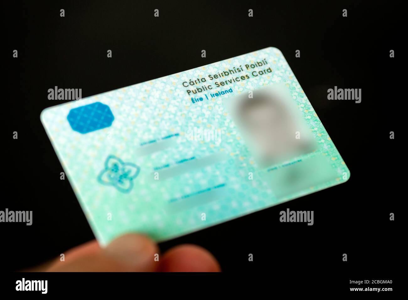 Hand holding Public Services Card Ireland second generation Social Welfare ID valid from 2019 Stock Photo