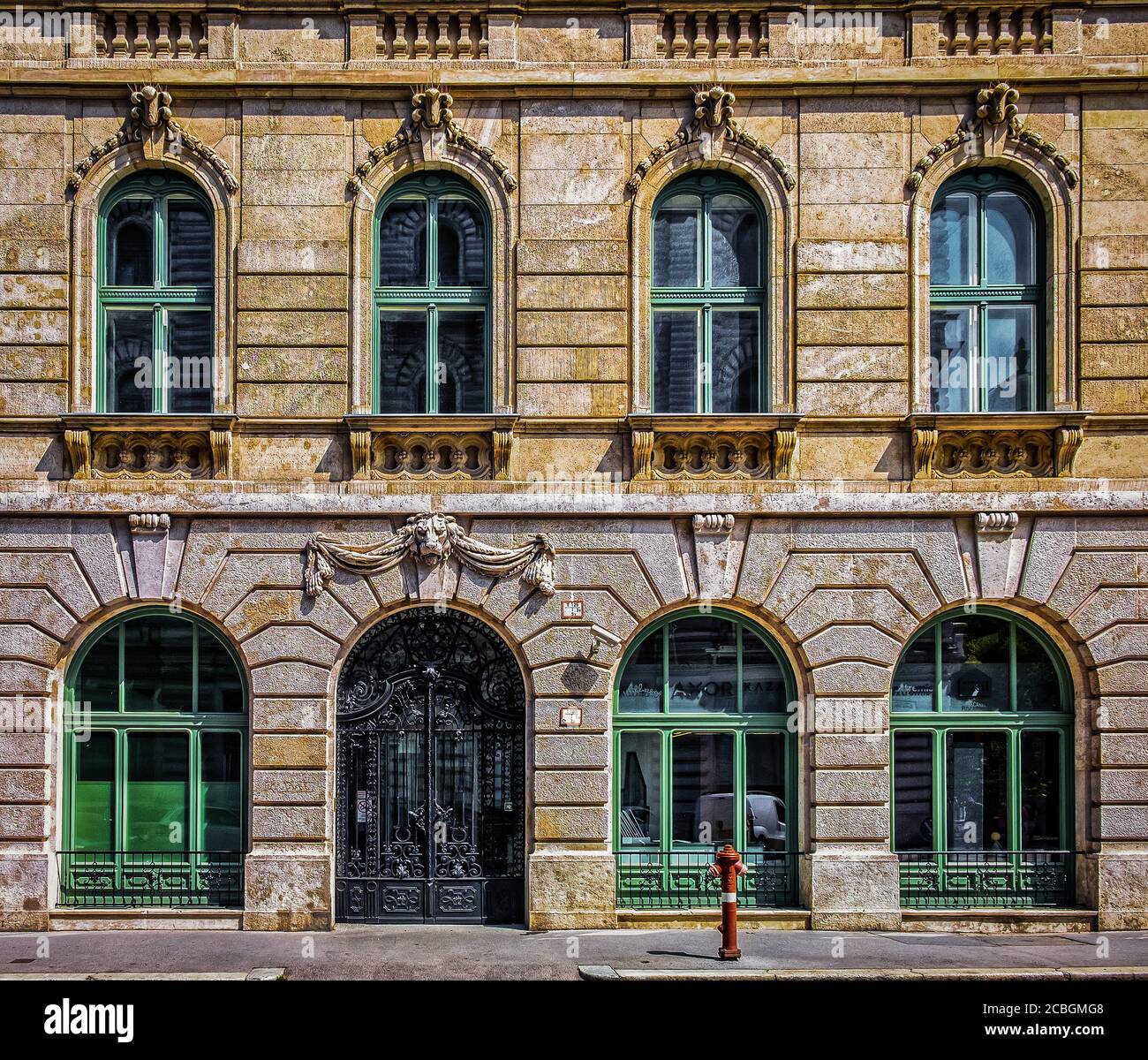 Budapest, Hungary, Aug 2019, view of an old building with a black wrought iron gate in the centre of the capital Stock Photo