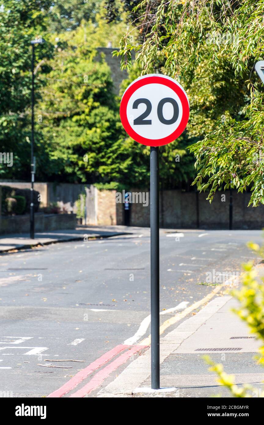 20 mph (Miles Per Hour) British road speed limit sign on residential built up area Stock Photo