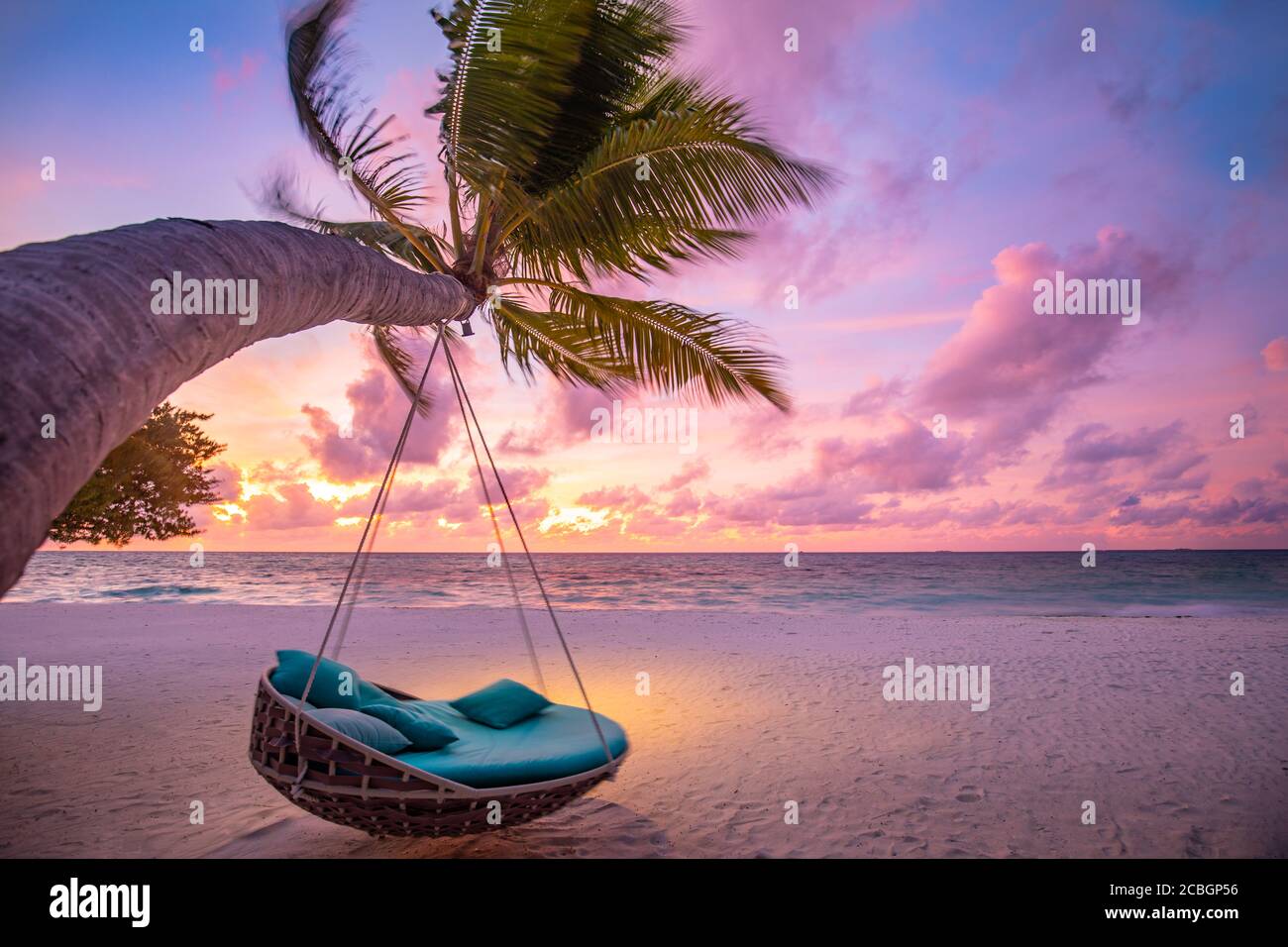 Tropical sunset beach background as summer landscape panorama with beach  swing or hammock on palm tree sand calm sea beach banner. Perfect beach  view Stock Photo - Alamy