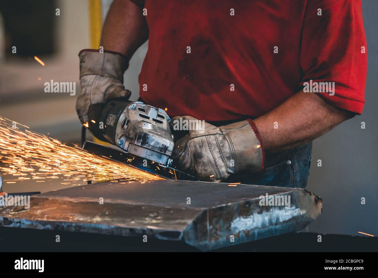 Hands of workers grinding steel in the metal industry Stock Photo Alamy