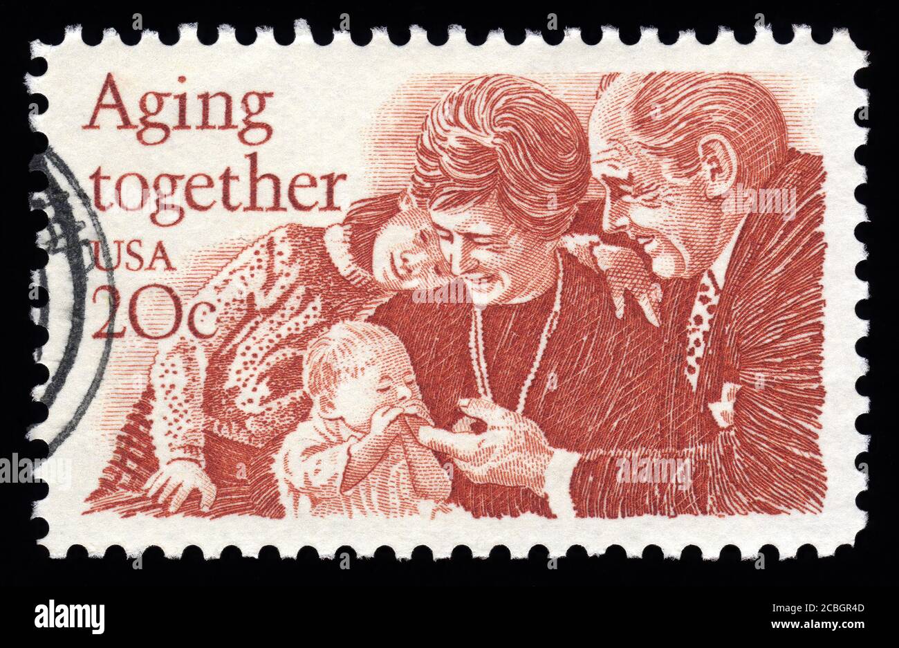London, UK, February 5 2011 - Vintage 1982 USA cancelled postage stamp showing an image of a family ageing together stamp collecting stock photo Stock Photo