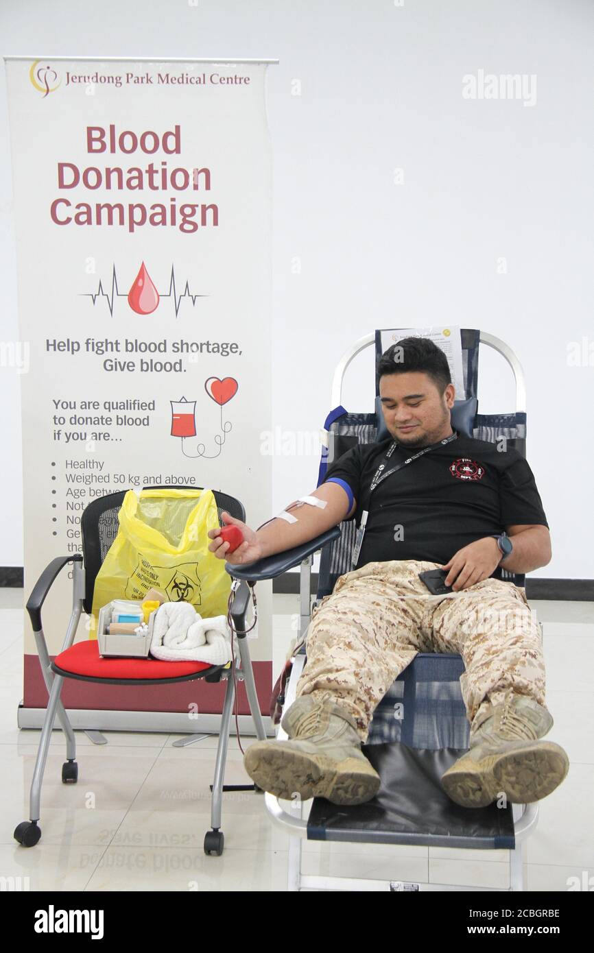 Bandar Seri Begawan. 13th Aug, 2020. A staff member of Hengyi Industries Sdn Bhd donates blood in Bandar Seri Begawan, capital of Brunei, Aug. 13, 2020. Hengyi Industries Sdn Bhd, a China-Brunei petrochemical joint venture, held a blood donation drive on Wednesday and Thursday in collaboration with Brunei's Jerudong Park Medical Center, with the participation of over 60 Hengyi staff and management. Credit: Xinhua/Alamy Live News Stock Photo