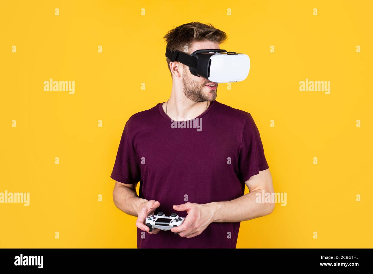 It is so real. man wearing virtual reality goggles. game console using with  VR headset. man with glasses of virtual reality. Future technology concept.  guy getting experience using VR-headset glasses Stock Photo -