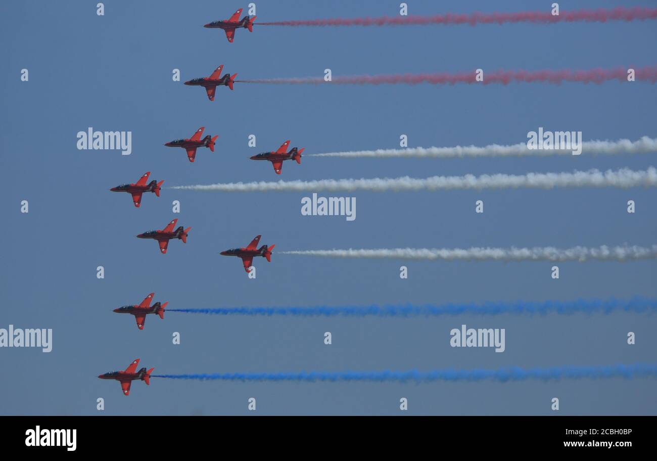 The world-famous Red Arrows aerobatics display team put on an incredible display over Anglesey today.  The team held a training rehearsal over RAF Valley in Anglesey, ahead of a number of fly-pasts this weekend for the Victory in Japan Day services. Credit Ian Fairbrother/Alamy Stock Photos Stock Photo