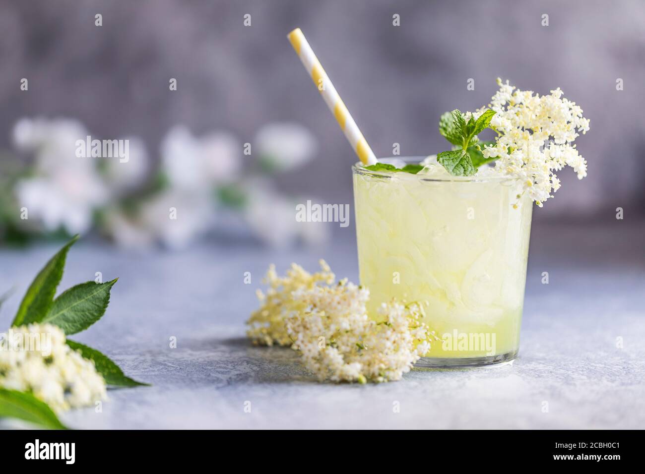 Fresh lemonade with lemon, lime juice and elderberry flowers. Healthy organic homemade refreshing nonalcoholic lemonade mocktail made of elderflower c Stock Photo