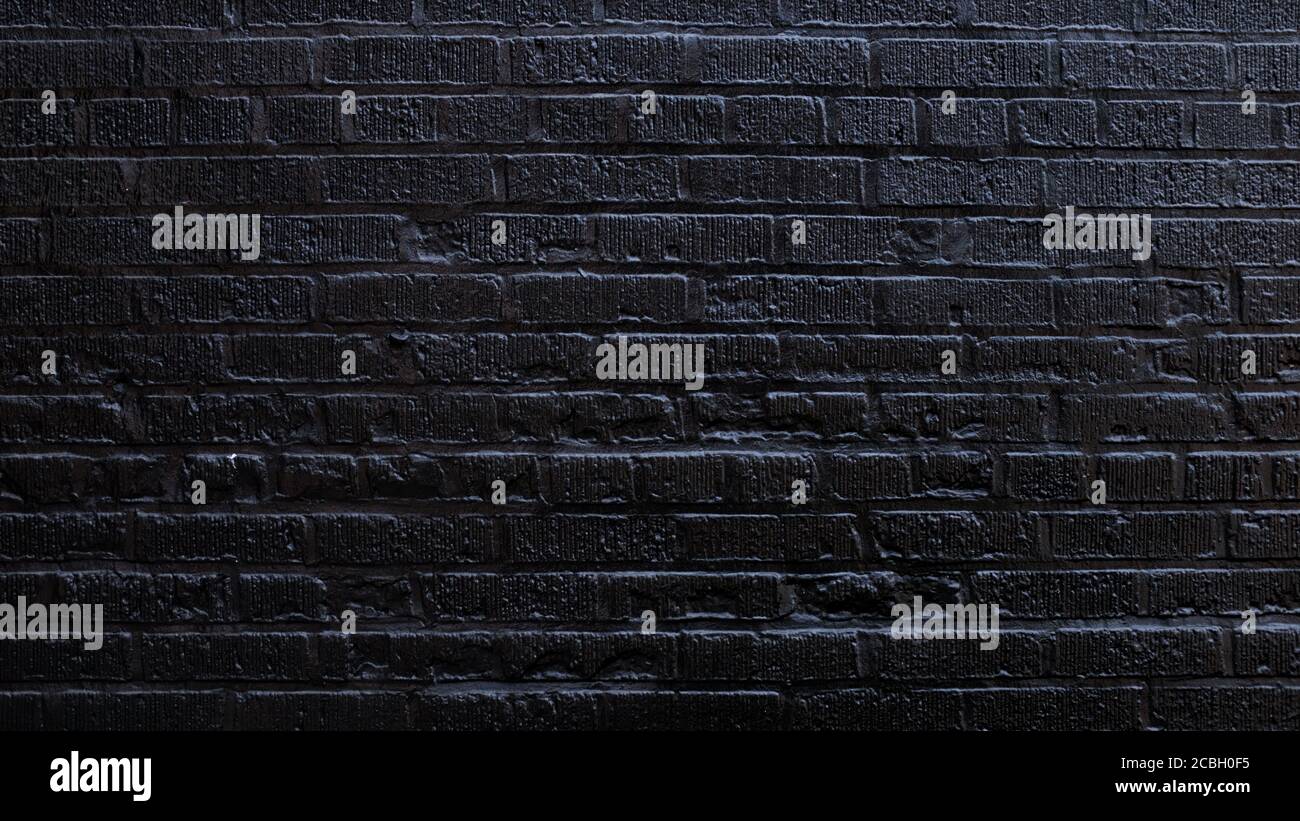 Brick Wall Painted Black Stock Photo