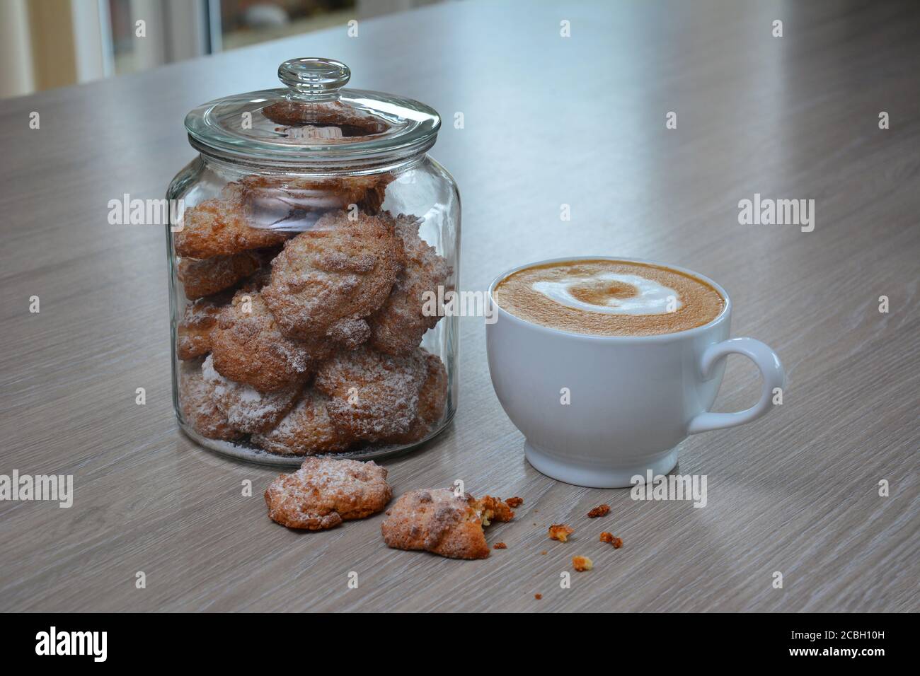 A cup of coffee with biscuits Stock Photo