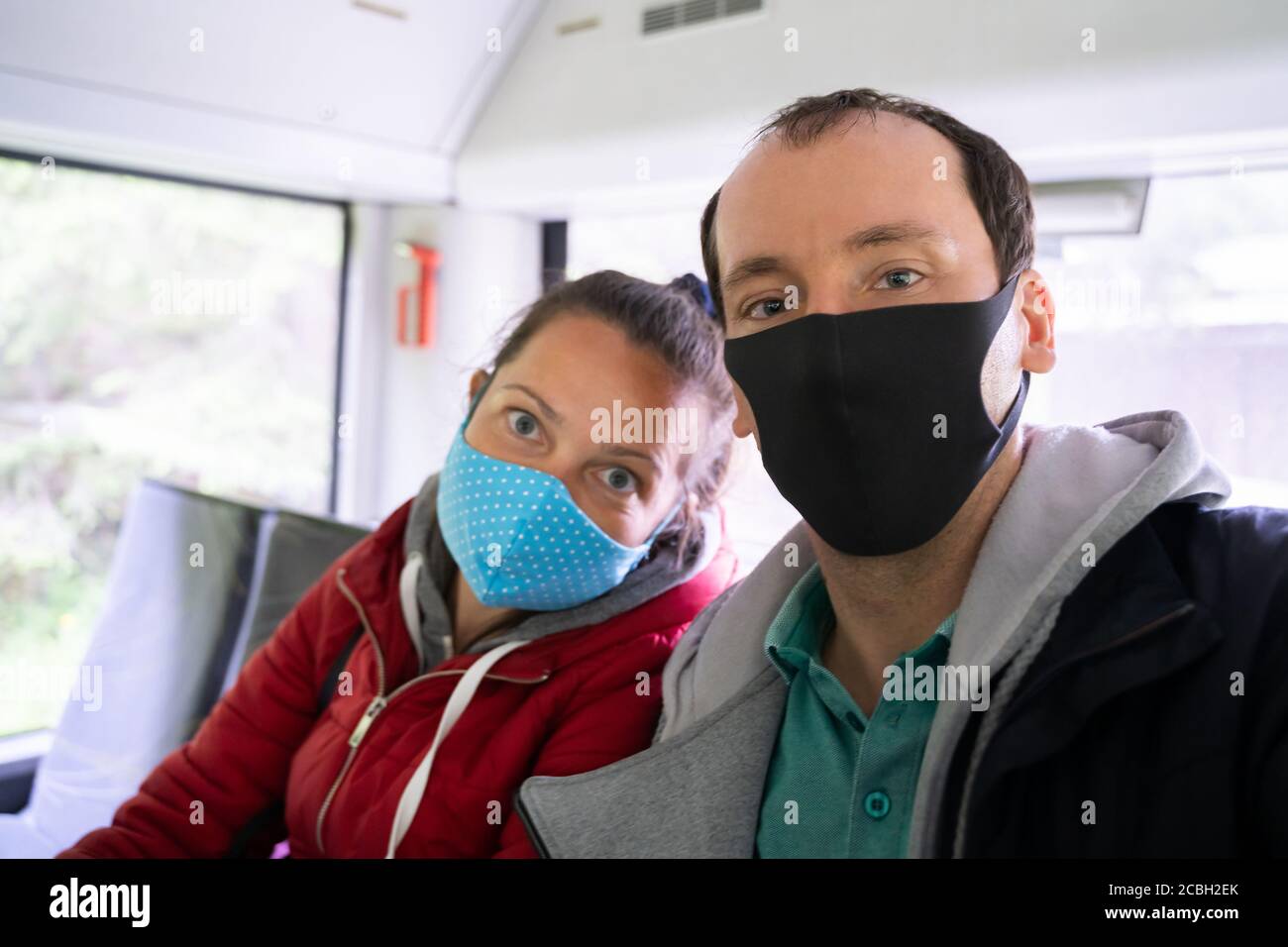 Couple On Public Bus Wearing Face Mask Stock Photo Alamy