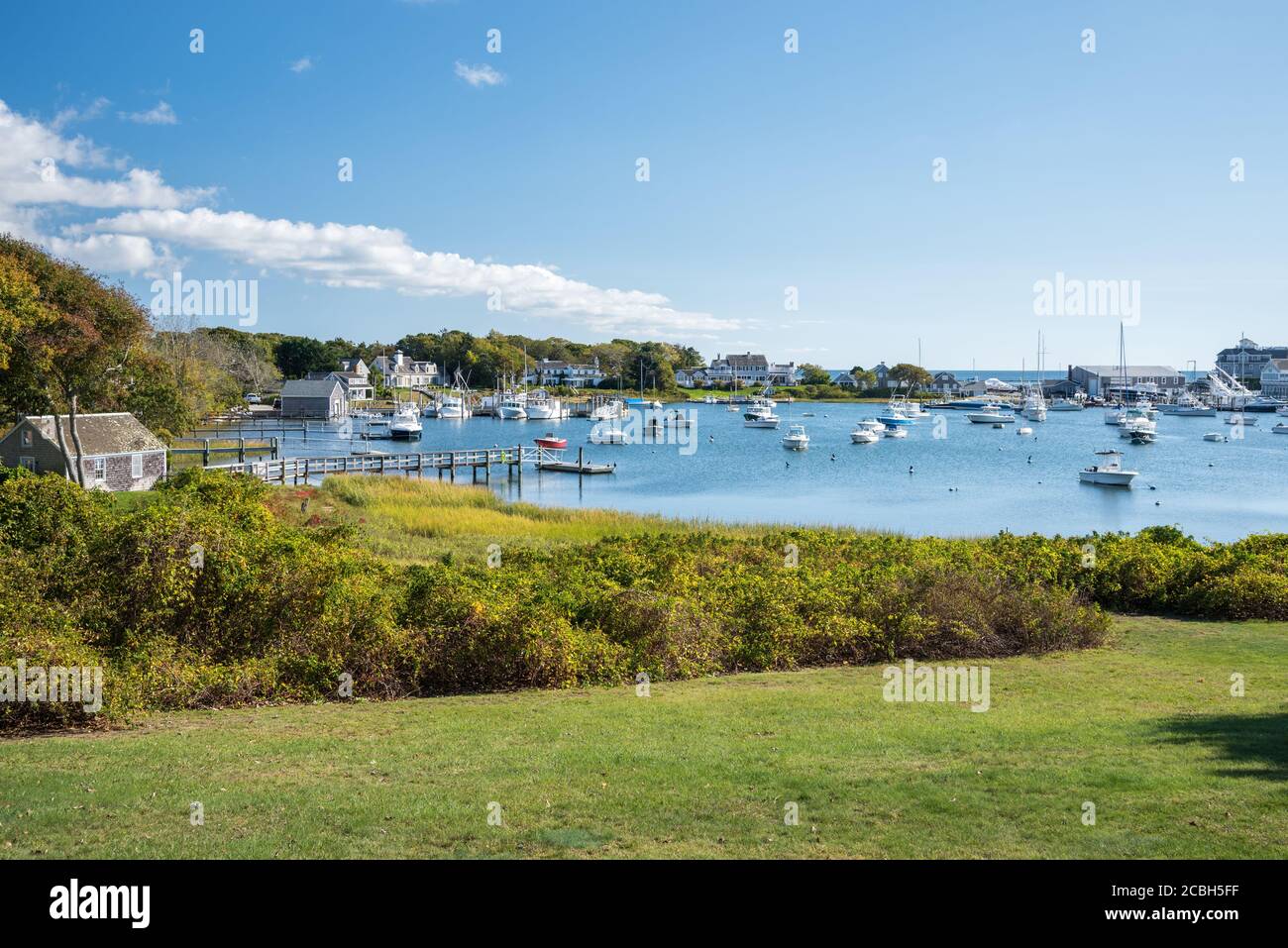 Boats anchored in a beautiful natural harbour on a sunny autumn day Stock Photo