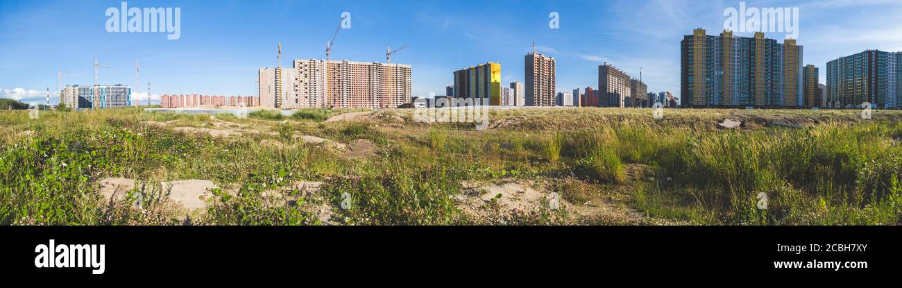 Behind Building Building construction behind the field. cityscape panorama Stock Photo ...