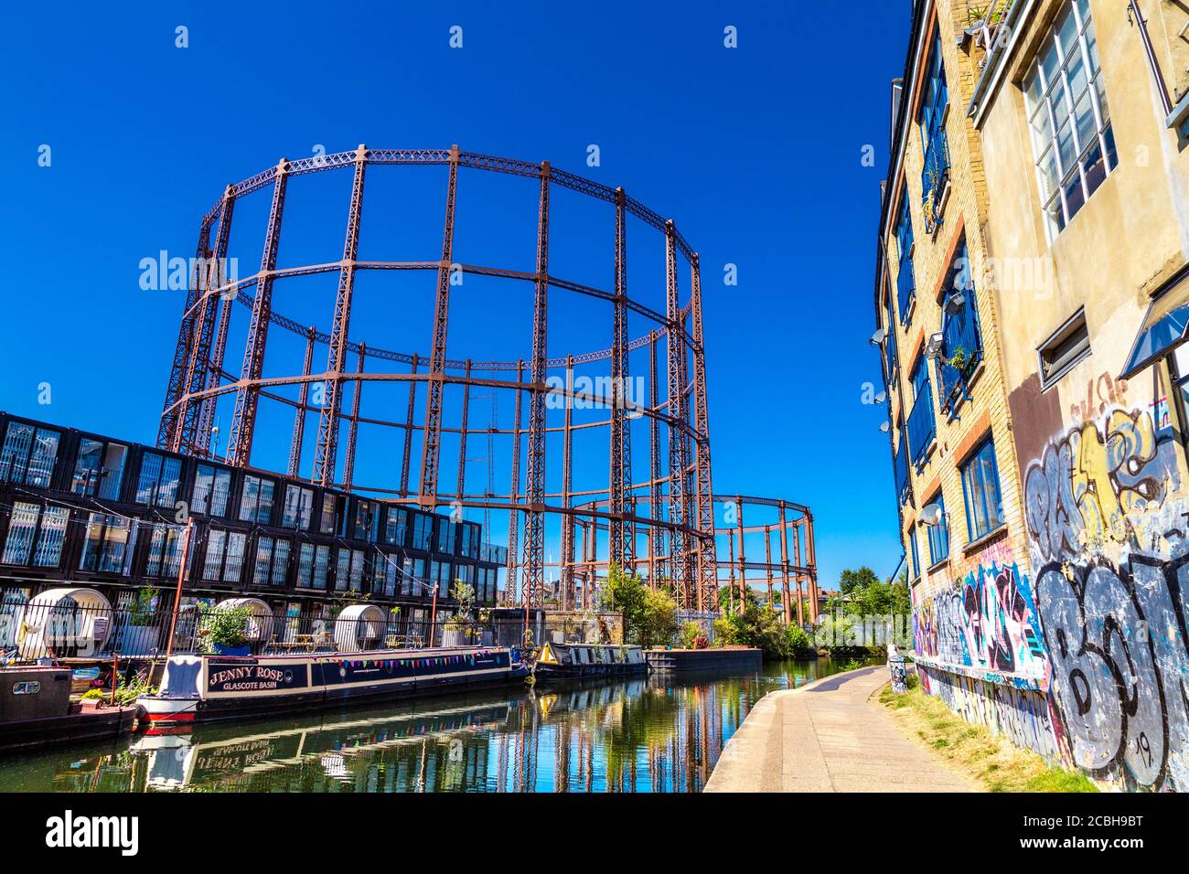 Containerville flexible workspace made from shipping containers and Bethnal Green gasholders, towpath by Regents Canal, London, UK Stock Photo