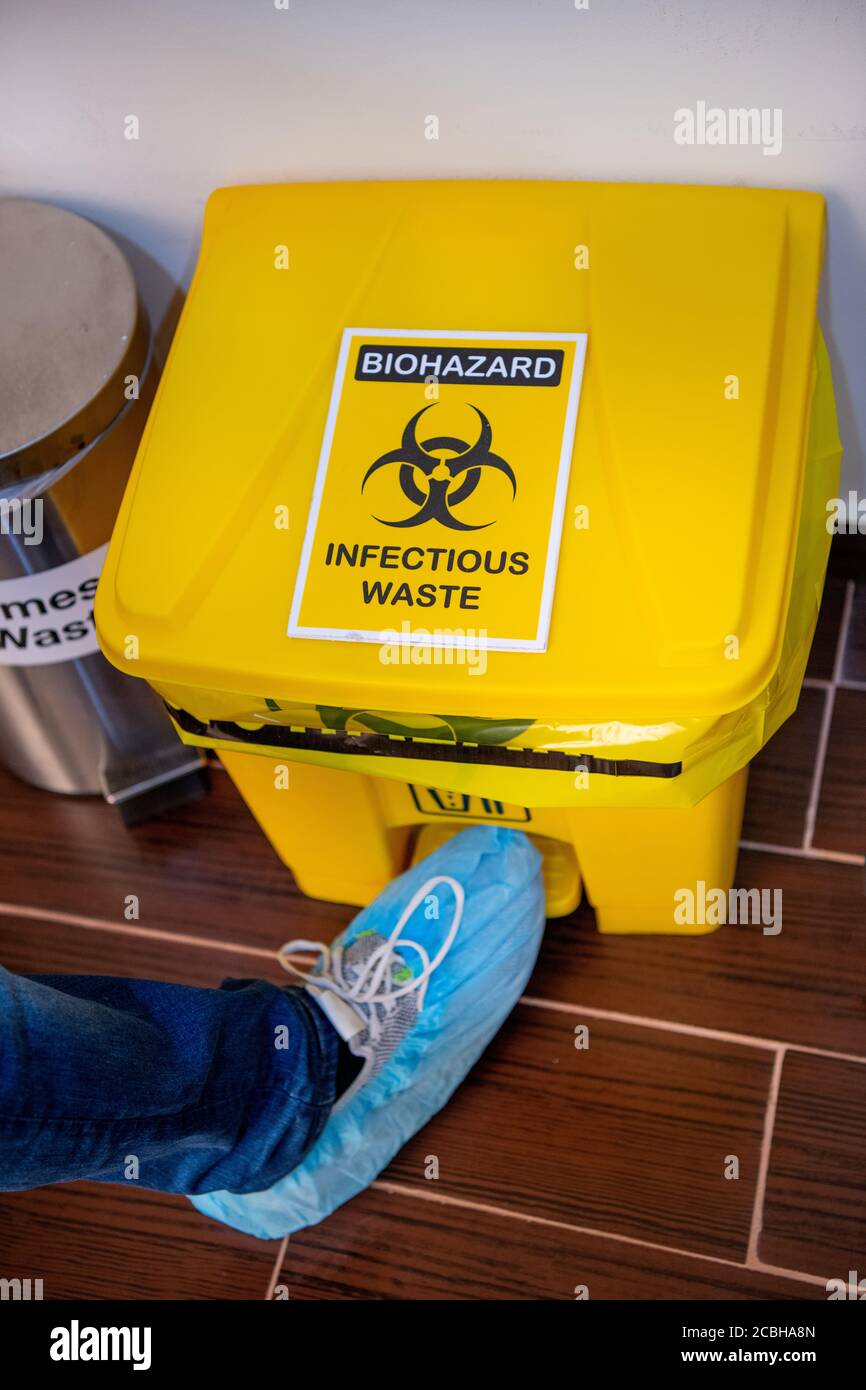 Infectious Waste bin in saloon Stock Photo Alamy